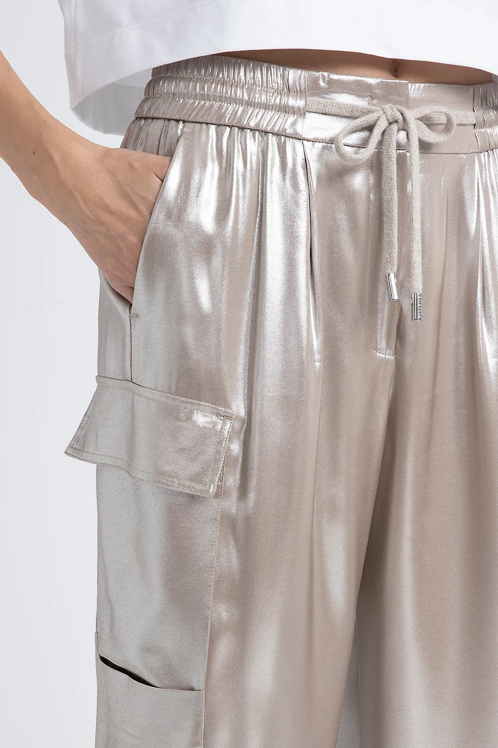 Baggy trousers in flowing silver laminated viscose twill