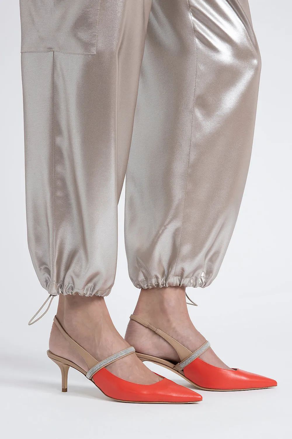 Baggy trousers in flowing silver laminated viscose twill